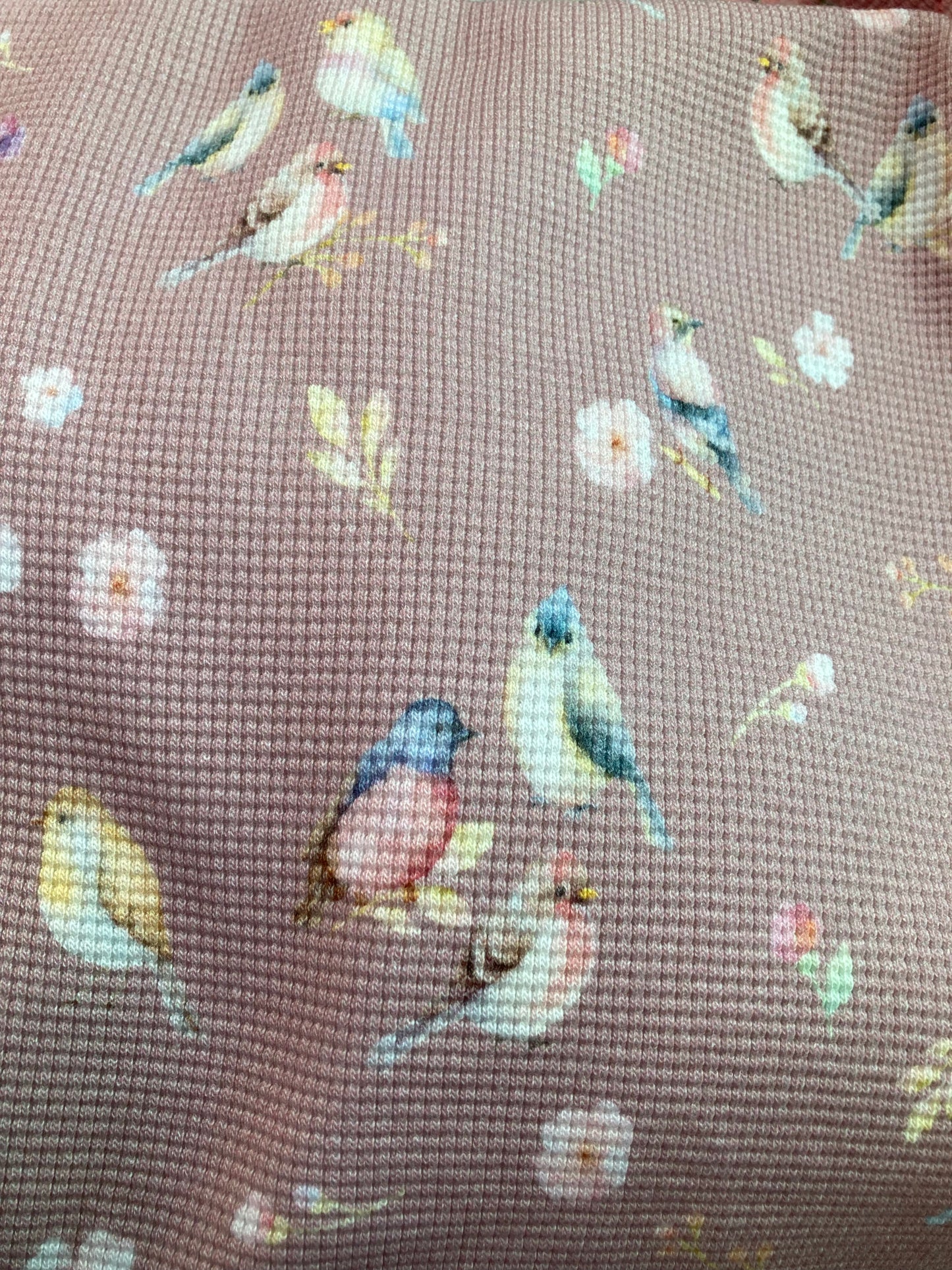 Old pink waffle fabric with bird print