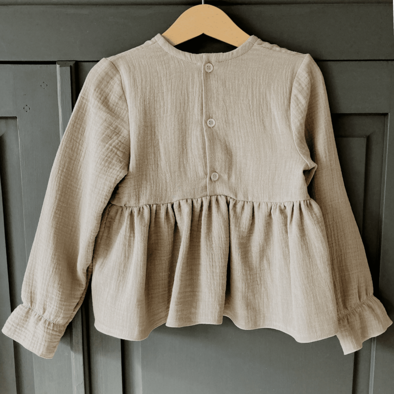 Cuteez's Peplum Blouse Flax: Trendy, duurzaam, en handgemaakt